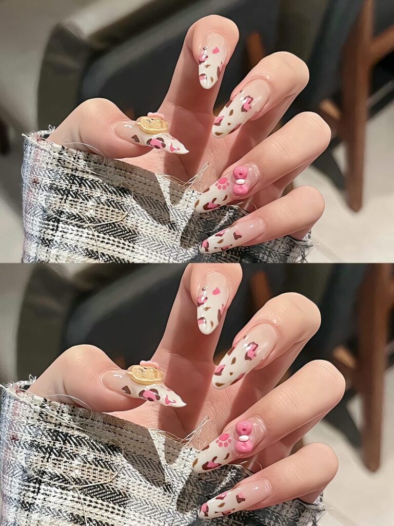 Nail họa tiết da báo màu hồng kết hợp cùng charm mèo Kitty vừa cá tính vừa dễ thương